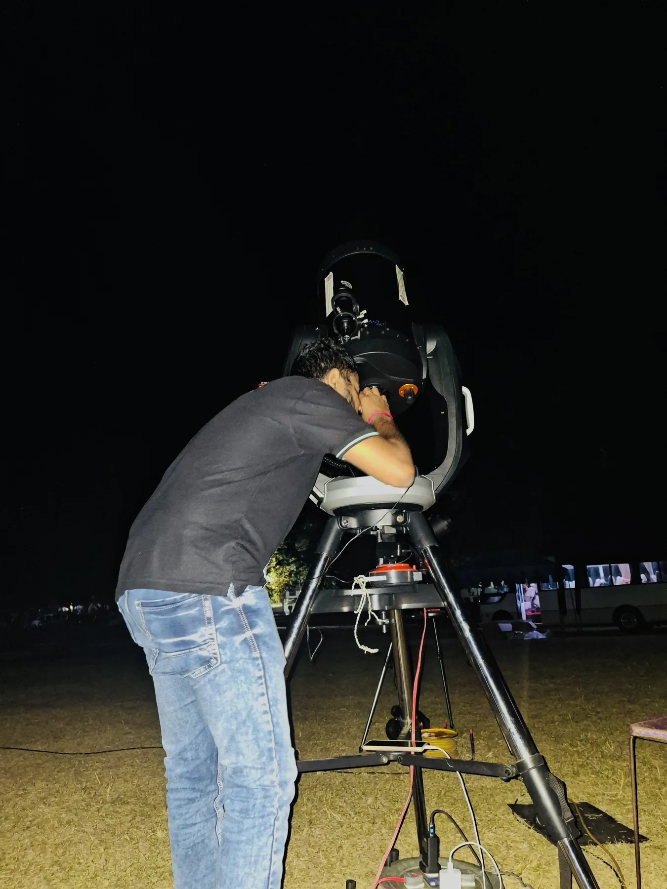 Sahan operating a telescope during a night observation session