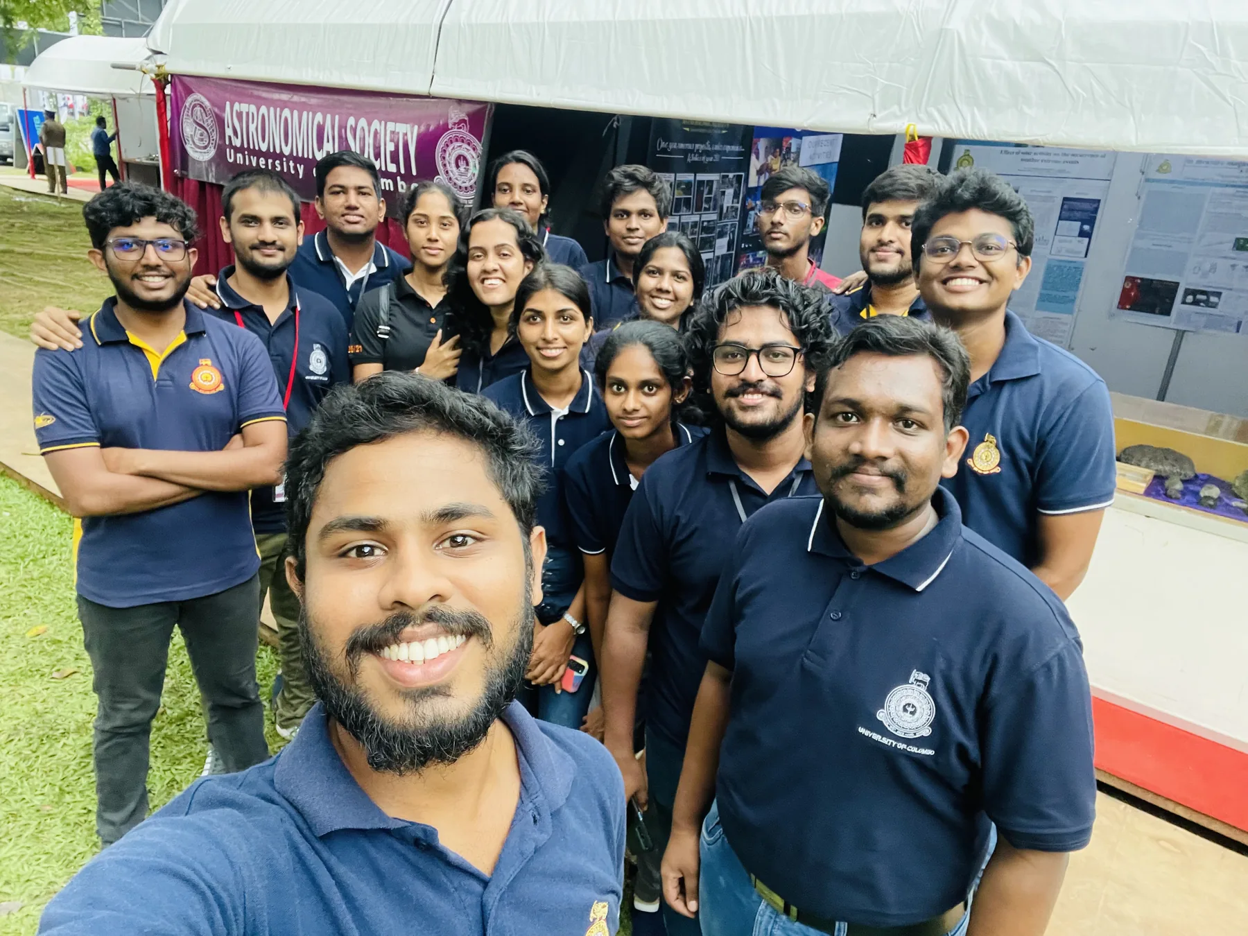 Sahan with astronomy outreach volunteers at a public event