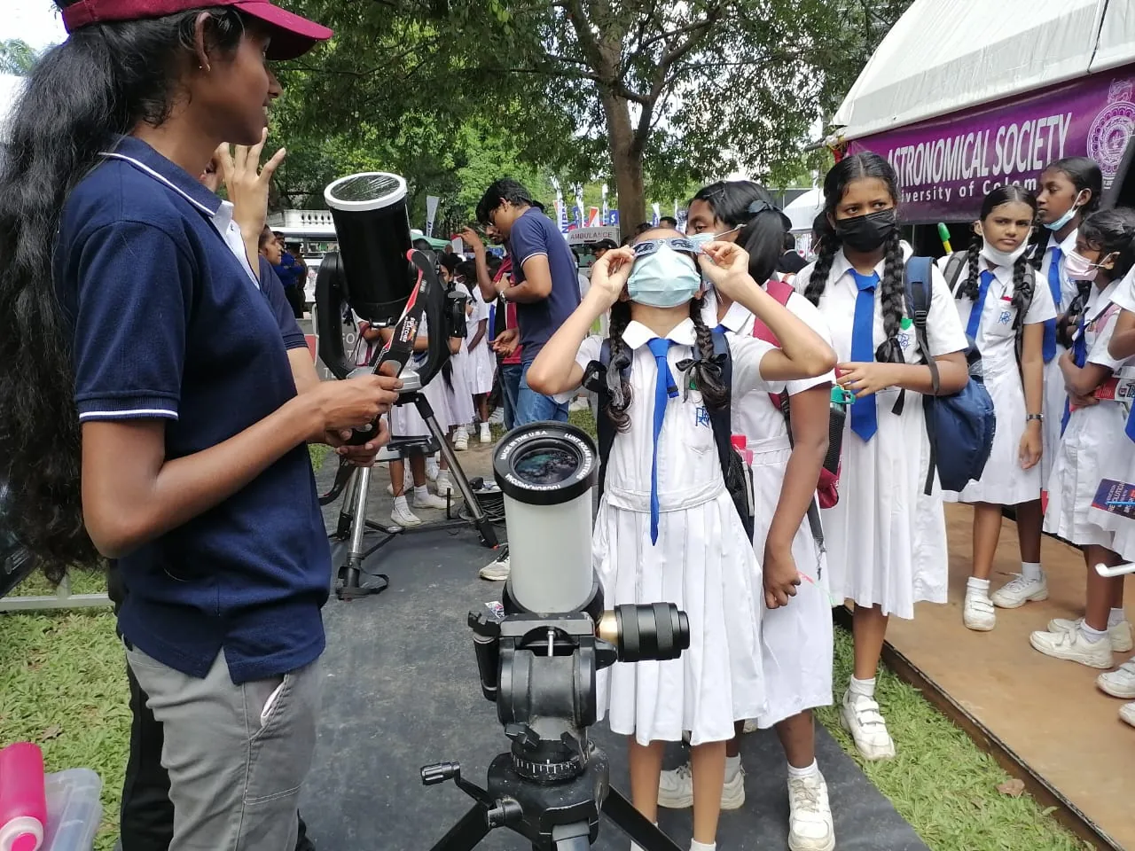 Students taking part in a supervised solar observation activity