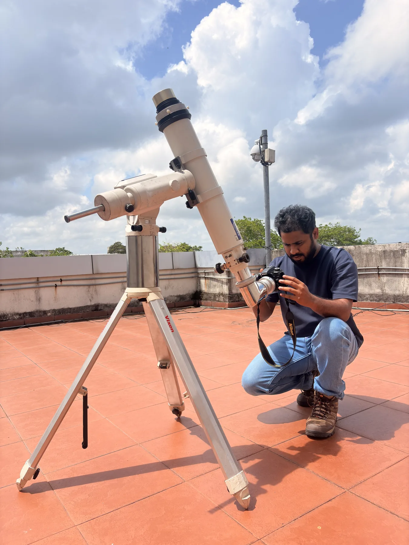 Sahan preparing a telescope for a daytime solar observation