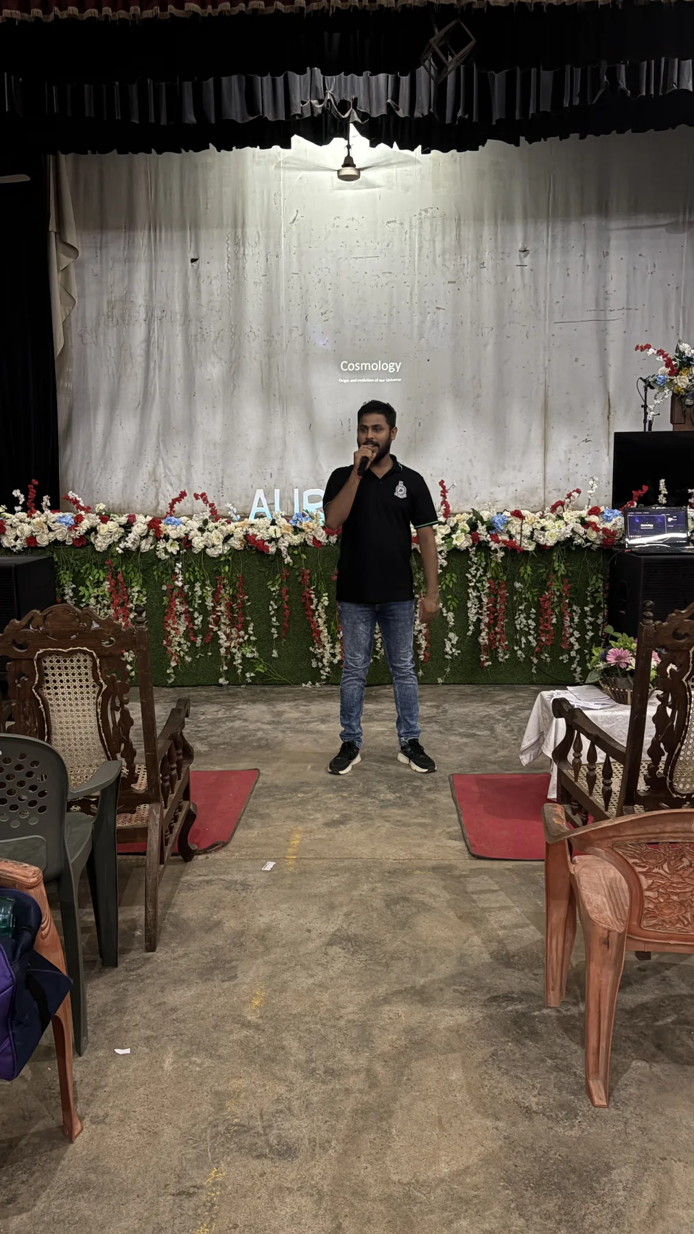 Sahan speaking to an audience at an astronomy event