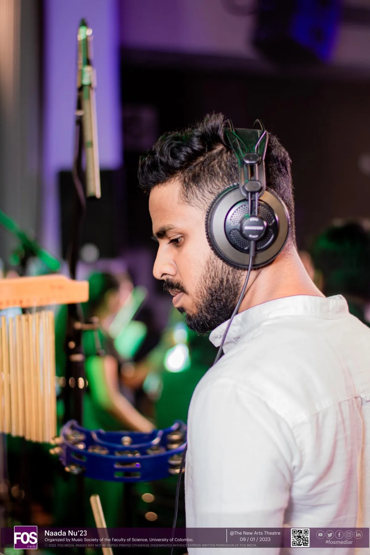 Sahan preparing percussion instruments during the Naada Nu 23 concert