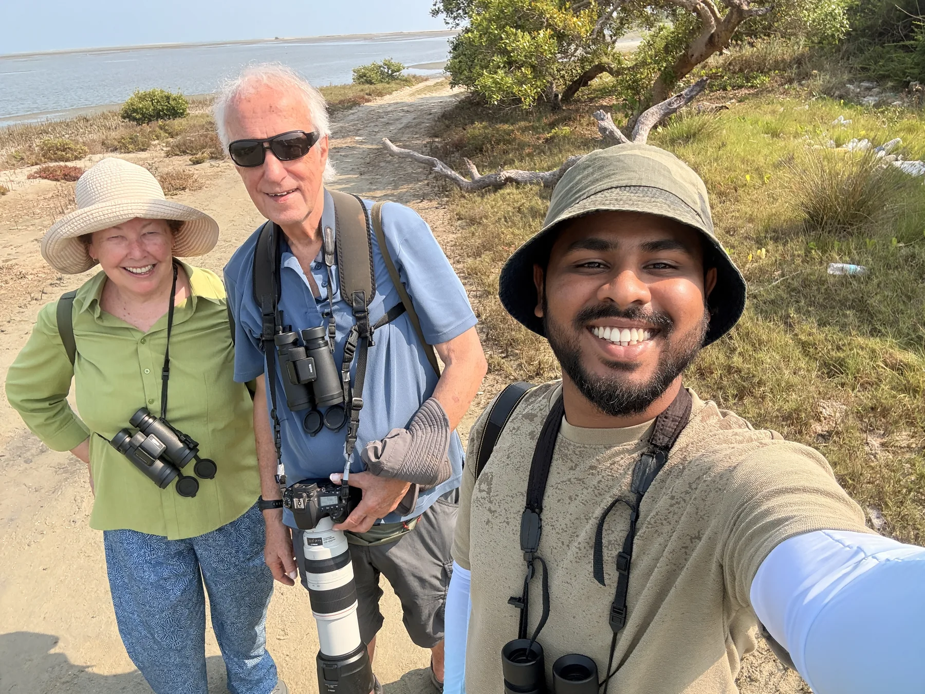 Sahan with two wildlife photographers during a coastal field outing