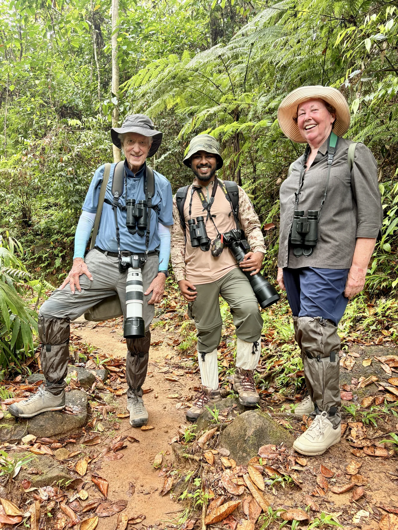 Sahan with fellow wildlife photographers on a forest trail