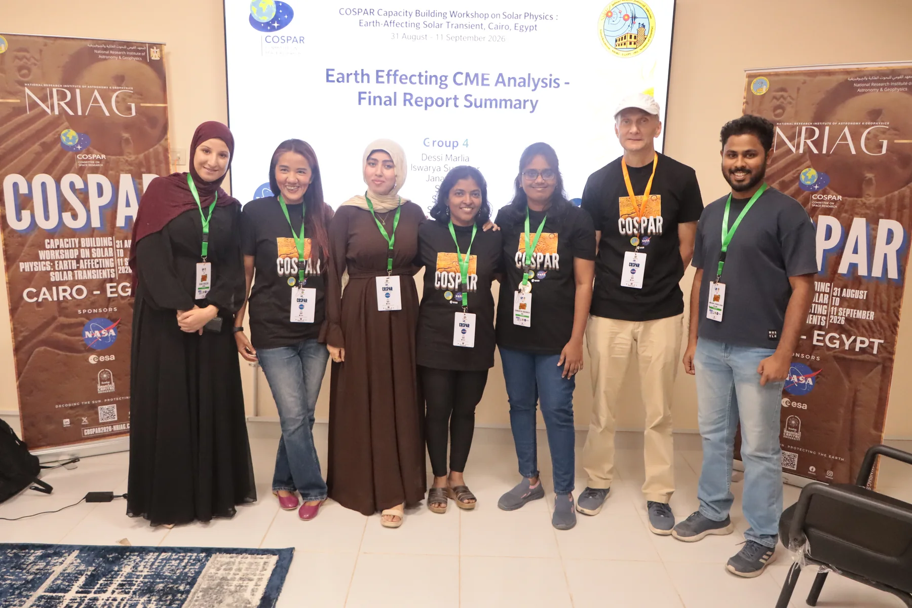 Sahan with a workshop team in front of their Earth-affecting CME analysis presentation